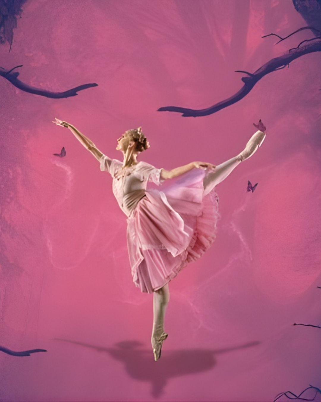 photo of a ballerina in pink posing against a pink background