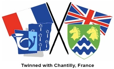 UK and French flags with Epsom & Ewell Borough Shield in front of the UK flag and Chantilly regional image of a bugle in front of the French flag. 